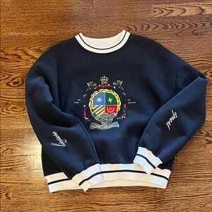 Luxurious Navy Crewneck Sweater with Embroidered Crest